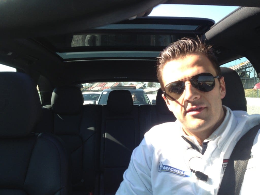 Ignacio Milán in the cockpit wearing a Michelin polo during a circuit session