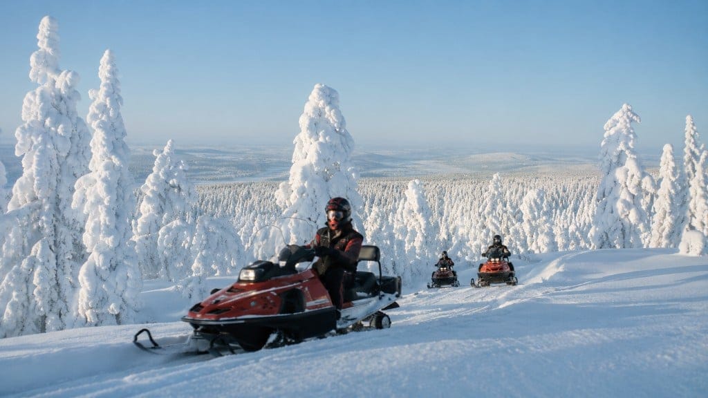 Snowmobile ride through a snow forest at GTlife Winter Stage